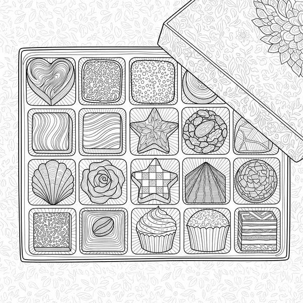 Open box of chocolates with bonbons in different shapes and designs